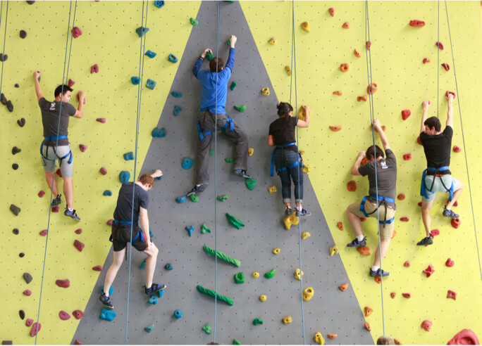 Atlassians on climbing wall