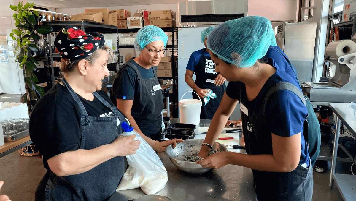 Atlassian volunteers making meals for the community