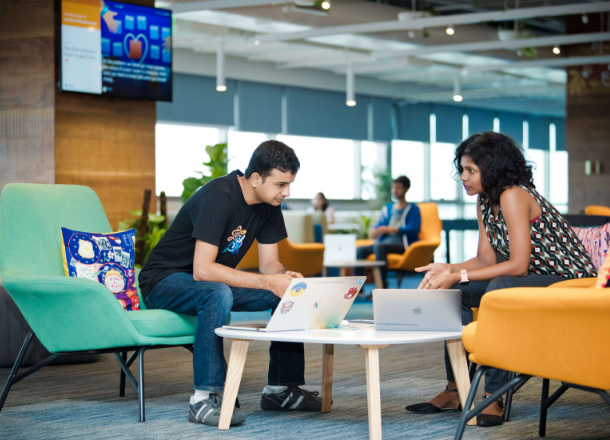 Two people brainstorming in our Bengaluru office