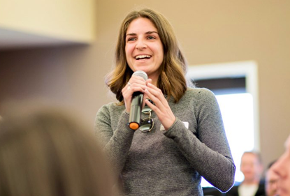 An APM speaking to a crowd